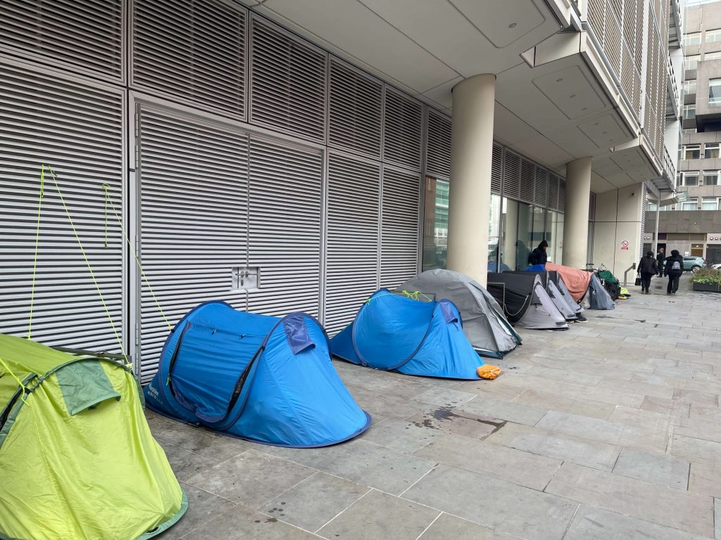 Camp of homeless people's tents outside University College London Hospital near Euston in Camden