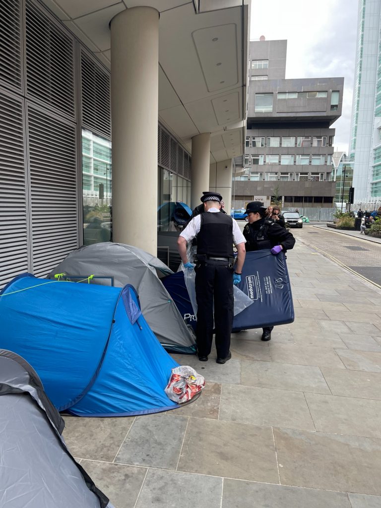 Police removing belongings from tents outside UCLH